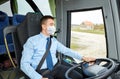 Bus driver in mask talking to microphone