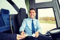 Bus driver with money selling ticket to passenger Royalty Free Stock Photo