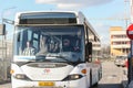 The bus driver with passengers while driving.