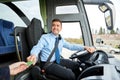 Bus driver taking ticket or card from passenger Royalty Free Stock Photo