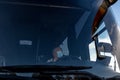 Bus driver wearing a medical mask, from the side of the frontal window Safe driving during a pandemic, protection