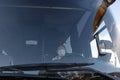 Bus driver wearing a medical mask, from the side of the frontal window Safe driving during a pandemic, protection