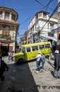 A bus drives down a steep and narrow street in Cerro Cumbre in La Paz in Bolivia. Royalty Free Stock Photo