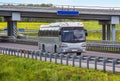 Bus Goes on Highway Under Bridge In Country Royalty Free Stock Photo