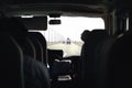 Bus on highway. Coach, shuttle or minivan. Airport transfer with taxi van. Passenger interior view from back seat. Royalty Free Stock Photo