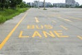 Bus lane sign painted on concret road Royalty Free Stock Photo