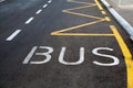 Bus lane sign painted on road. Royalty Free Stock Photo