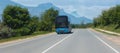 Bus moves along a suburban highway Royalty Free Stock Photo