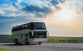 bus moves along a suburban highway at sunrise Royalty Free Stock Photo