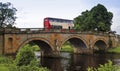 A Bus on an Old Bridge in England