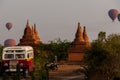 Bus Pagoda Stupa and hot air balloon over Bagan