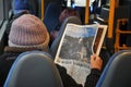 Bus passenger male reading leading danish daily Politiken