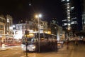 Bus and people at night