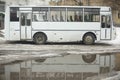 Bus and puddle. White transport