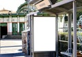 bus shelter with blank ad panel. billboard display. empty white lightbox sign. bus and metro stop in Vienna Royalty Free Stock Photo