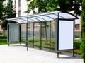 Bus shelter and bus stop. glass light box side ad panel. colorful sample image for mock-up Royalty Free Stock Photo