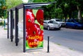 Bus shelter at a bus stop. glass light box side ad panel. colorful sample image for mock-ups