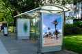 Bus shelter and bus stop. glass light box side ad panel. colorful sample image for mock-up Royalty Free Stock Photo