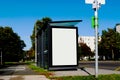 Bus shelter with white poster ad display glass Royalty Free Stock Photo