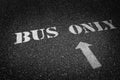 Bus Only Sign Painted on Roadway Asphalt for Direction Royalty Free Stock Photo