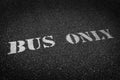 Bus Only Sign Painted on Roadway Asphalt for Direction Royalty Free Stock Photo