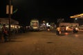 Bus stand at night and waiting vistors beside