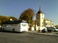 Bus stands at the bus station on the background of Cathedral of the Transfiguration of Lord in
