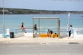 The bus station and tourists near beach Royalty Free Stock Photo