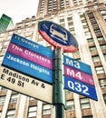 Bus stop against tall buildings, New York City Royalty Free Stock Photo