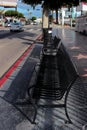 Bus stop with a bench at Hollywood Boulevard and N Gower St intersection