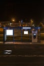 Bus stop with a billboard at night Royalty Free Stock Photo