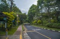 a bus stop in an empty street, near the National University of Singapore