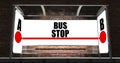 Bus stop with glowing billboard at night Royalty Free Stock Photo