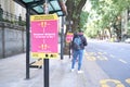 Bus stop with information signal on the need to maintain social distance, to prevent the spread of coronavirus disease, Covid-19