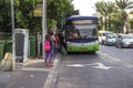 Bus stop with people Israel Tel Aviv.