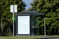 Bus stop and bus shelter with white blank advertisement panel Royalty Free Stock Photo