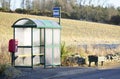 Bus stop shelter rural countryside uk public transport free travel pensioner senior person commute Royalty Free Stock Photo