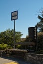 Bus stop sign and blue sky Royalty Free Stock Photo