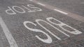 Bus stop sign painted on the tiles on the road Royalty Free Stock Photo