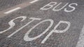 Bus stop sign painted on the tiles on the road Royalty Free Stock Photo