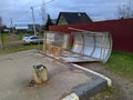 a bus stop that was torn down by a strong wind.