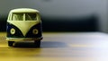 Bus toy on wooden background oriented on the side type cleavage available