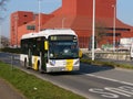 A bus (Van Hool hybrid) of De Lijn (company), drives from 't Zand to Bruges station.