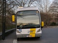 A bus (Van Hool hybrid) of De Lijn (company) is out of service at Bruges station.