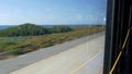 Bus window, pacific coast highway, freeway 101, California USA. Road trip along summer ocean or sea.