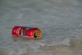 Busaiteen, Bahrain - August 21: A empty beer can floating in the sea thrown by the people after use on 21 August, 2020 Royalty Free Stock Photo