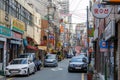 City street with advertising signboards and electric wires in air