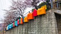 Busan,South Korea-March 2014: Colorful house figures decorations hanging at the wall in a row at Gamcheon Culture Village