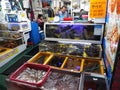 A man at a live fish shop in Busan`s Jagalchi Market