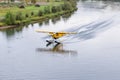 Bush float plane landing on  river in Alaska Royalty Free Stock Photo